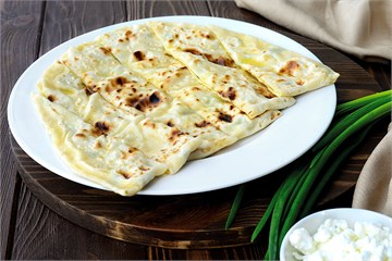 {{photo.Alt || photo.Description || 'Чуду с творогом и зелёным луком '}}